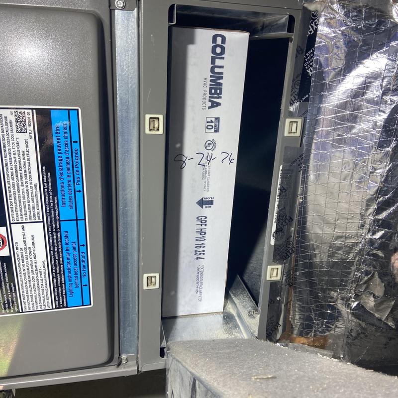 HVAC air filter installation inside unit panel