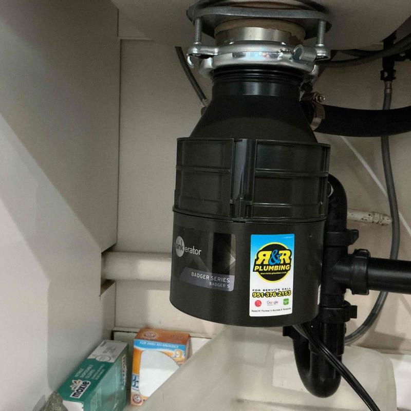 Garbage disposal unit installation under sink