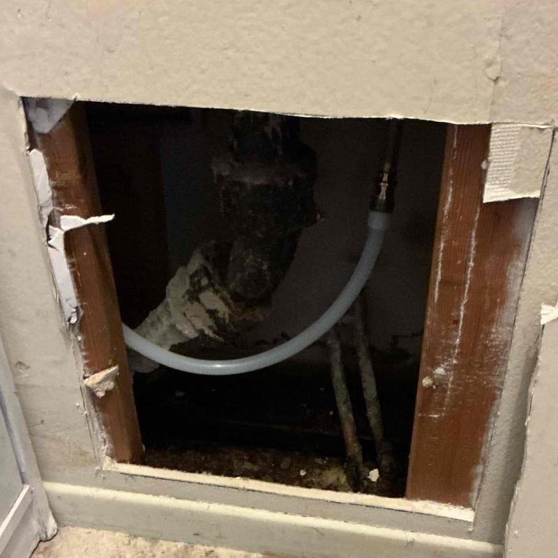 PEX pipe reroute through wall opening with old pipes