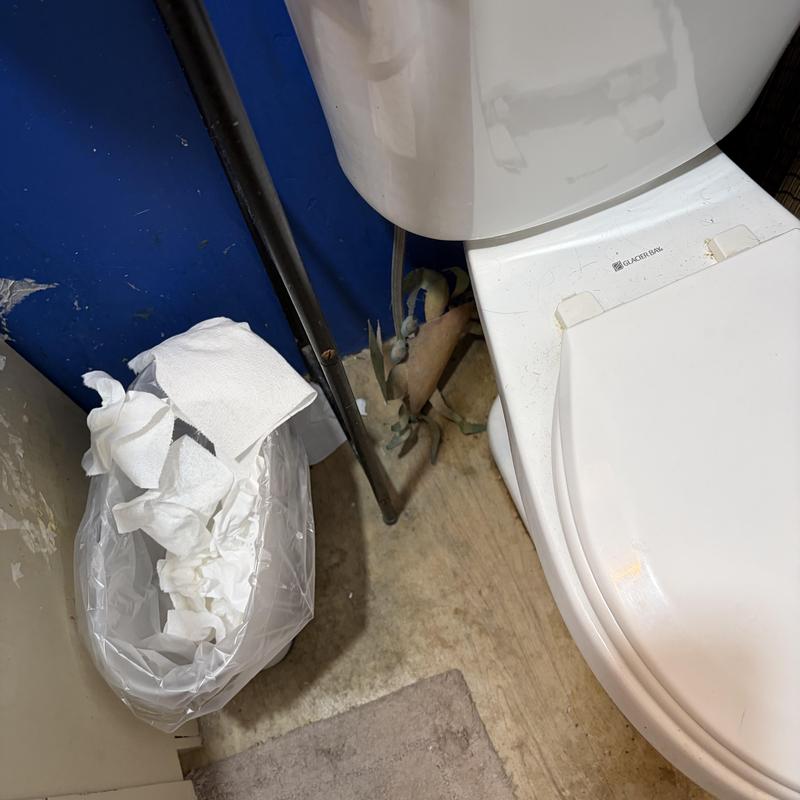 Toilet installation and bathroom floor plumbing inspection