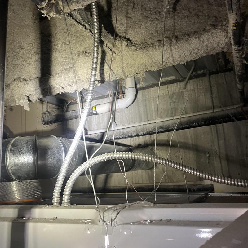 HVAC ducting and electrical conduit in ceiling cavity