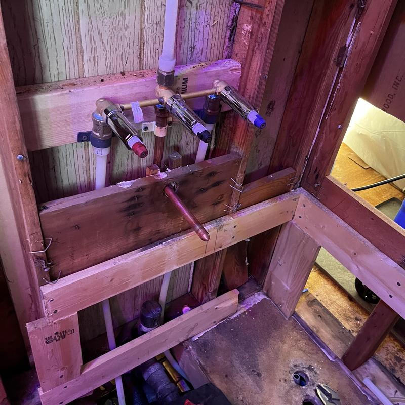 Shower valve plumbing with PEX and copper piping installation