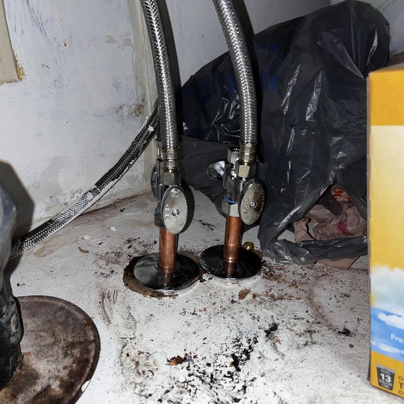 Copper water supply lines with angle stops installed