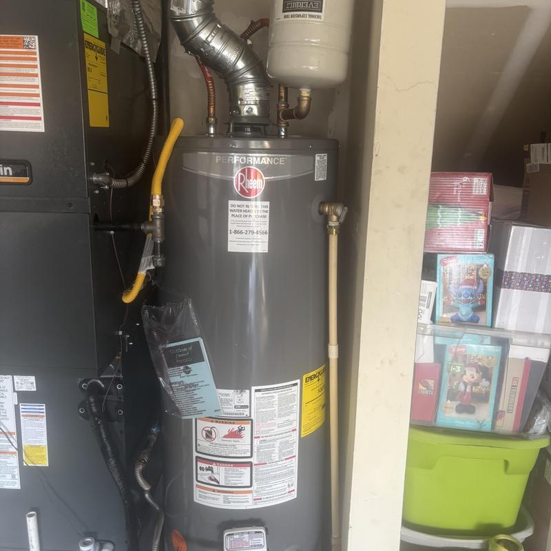 Water heater installation with vent and expansion tank