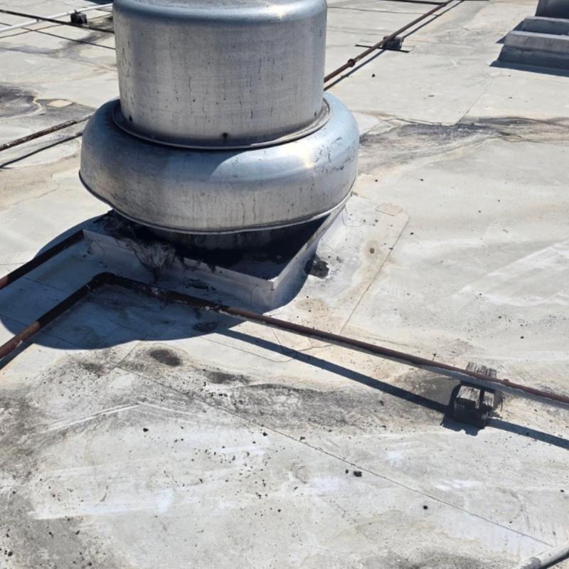 TPO roof around rooftop exhaust vent with damage TPO roof around rooftop exhaust vent with damage