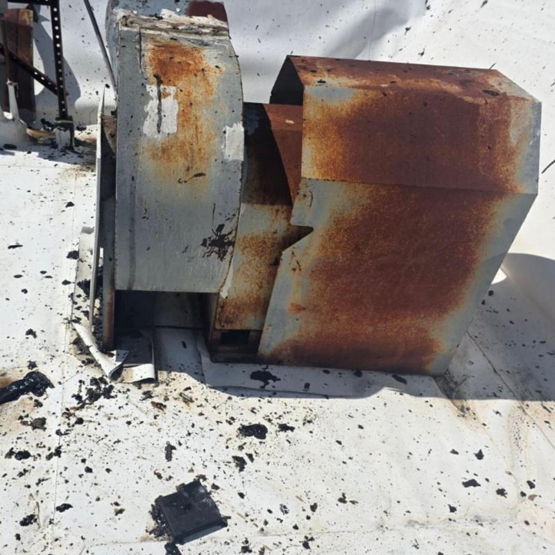 Rusty rooftop HVAC vent on TPO roof with debris Rusty rooftop HVAC vent on TPO roof with debris