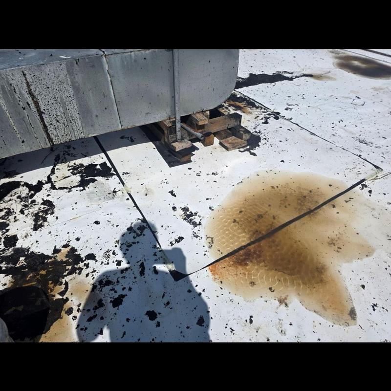 TPO roof with water leak and stain near support blocks TPO roof with water leak and stain near support blocks