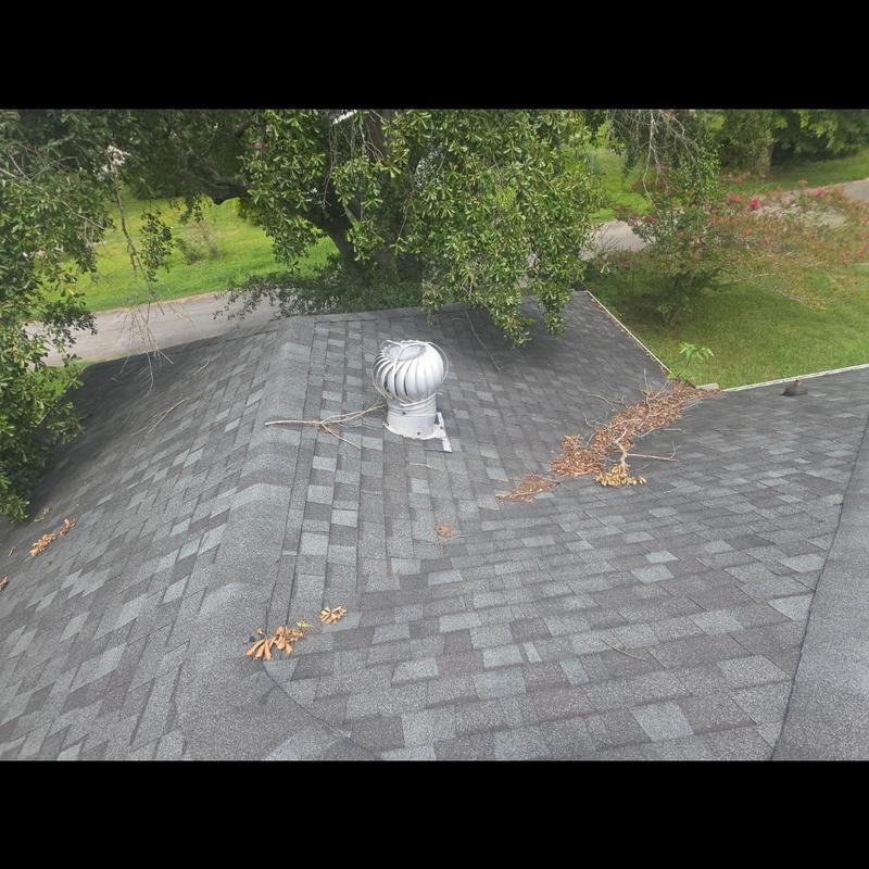 Turbine roof vent on shingled roof with debris Turbine roof vent on shingled roof with debris