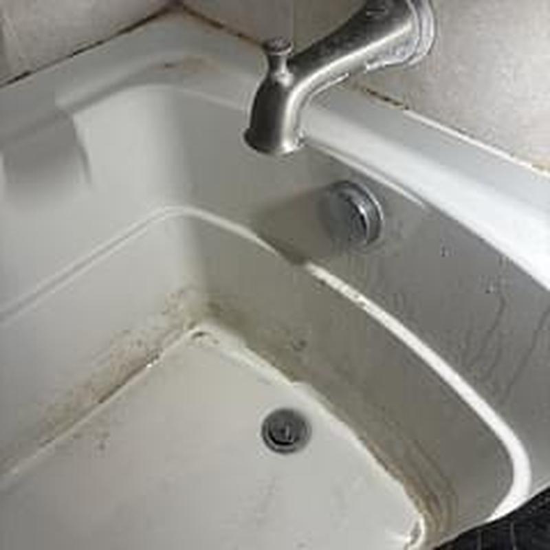 Bathtub drain and faucet with water flow in bathroom Bathtub drain and faucet with water flow in bathroom