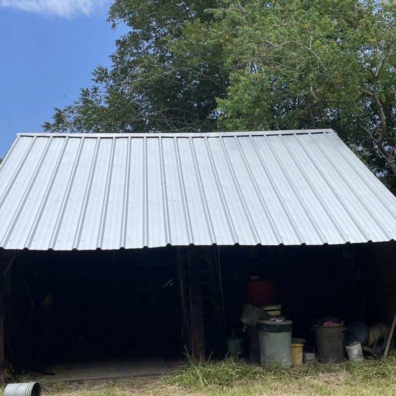 Metal panel roof on barn with storage below