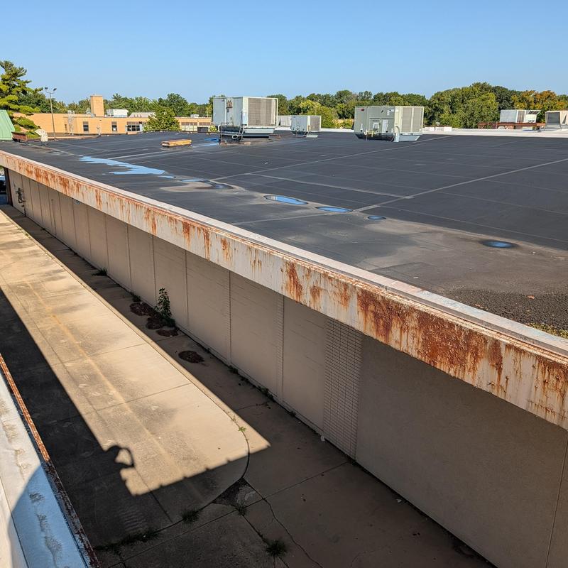 Black EPDM flat roof with rooftop HVAC units
