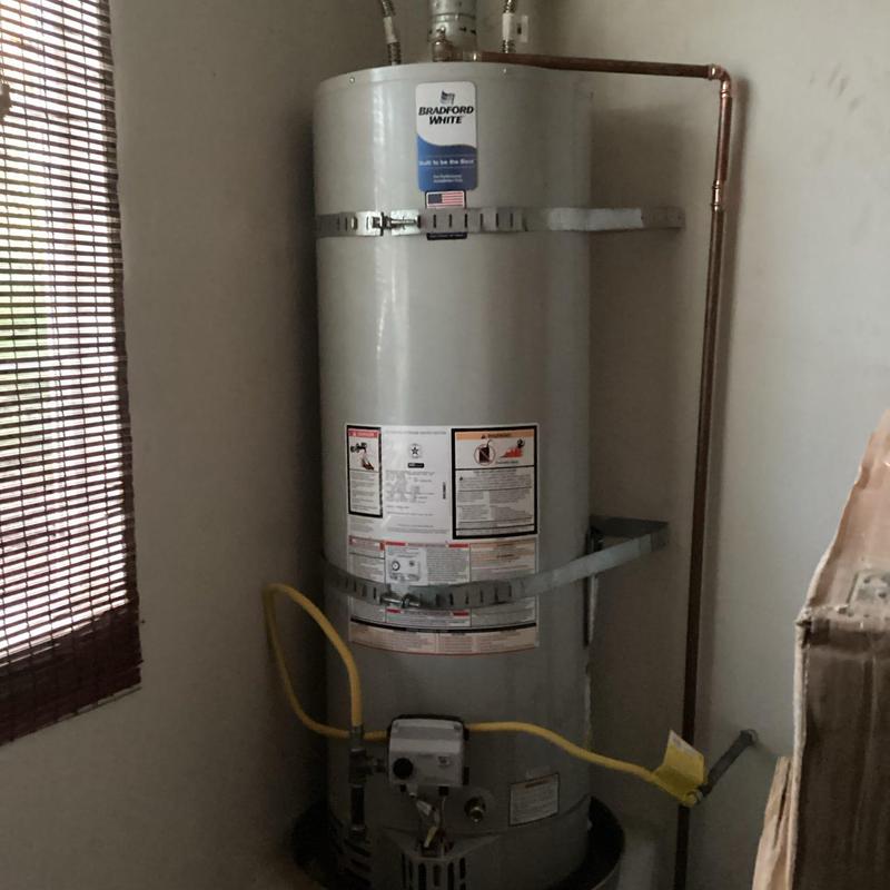 Bradford White water heater installation in corner
