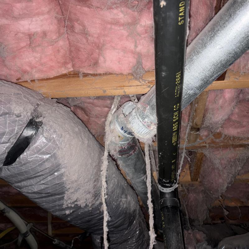 Flexible return air duct and disconnected dryer vent in crawlspace