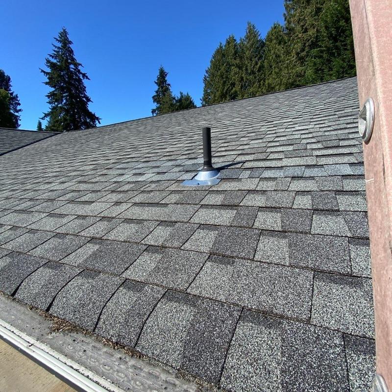Pipe boot on shingled roof with clear sky background Pipe boot on shingled roof with clear sky background