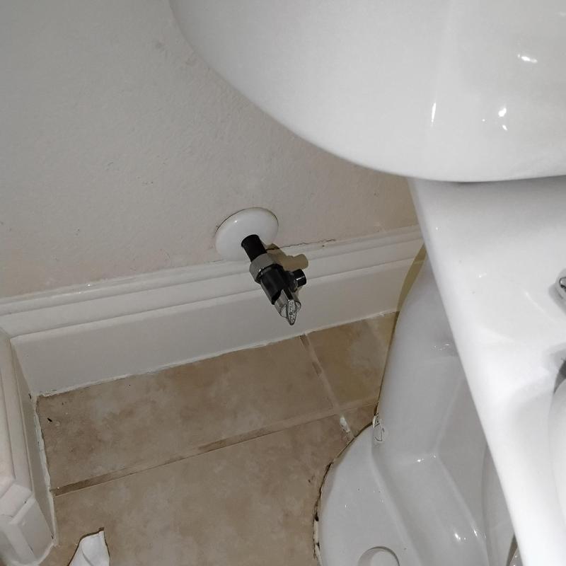 Toilet shut-off valve installation beside toilet base Toilet shut-off valve installation beside toilet base