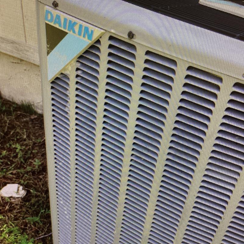 Daikin air conditioner condenser unit exterior close-up Daikin air conditioner condenser unit exterior close-up