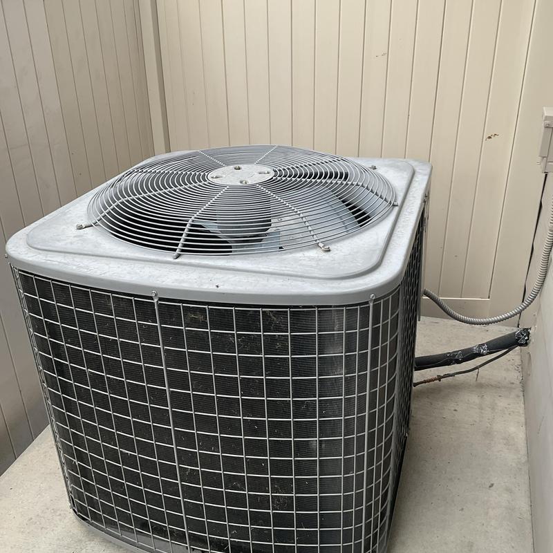 HVAC outdoor condenser unit with protective grille HVAC outdoor condenser unit with protective grille