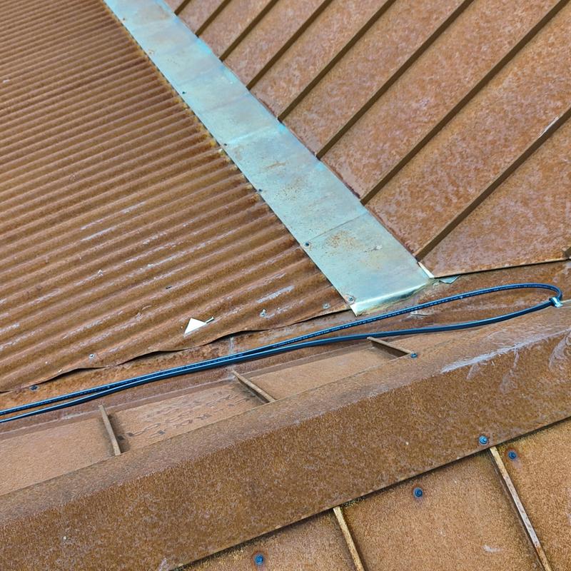 240v heat tape on metal roof ridge with flashing