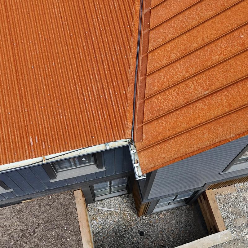 5-inch metal gutter and downspouts on roof corner
