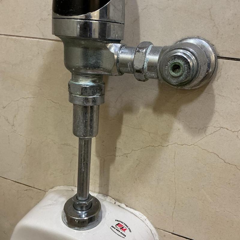 Flushometer valve and shut off valve on urinal Flushometer valve and shut off valve on urinal