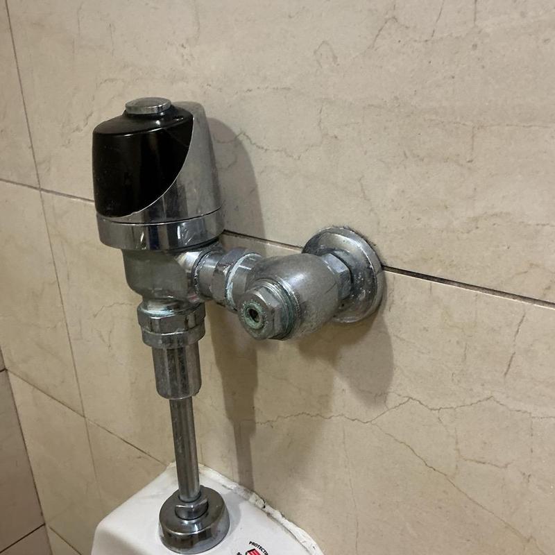 Flushometer valve on urinal with shut off valve Flushometer valve on urinal with shut off valve