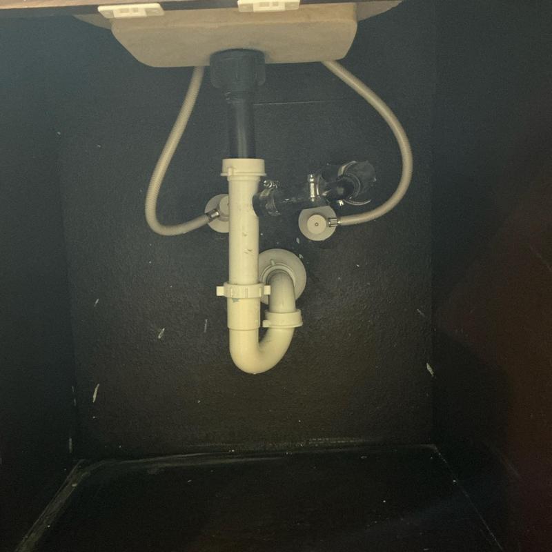 Sink drain pipe and water supply lines under cabinet Sink drain pipe and water supply lines under cabinet