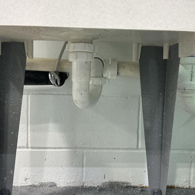 Eye wash station drain pipe installation under table Eye wash station drain pipe installation under table