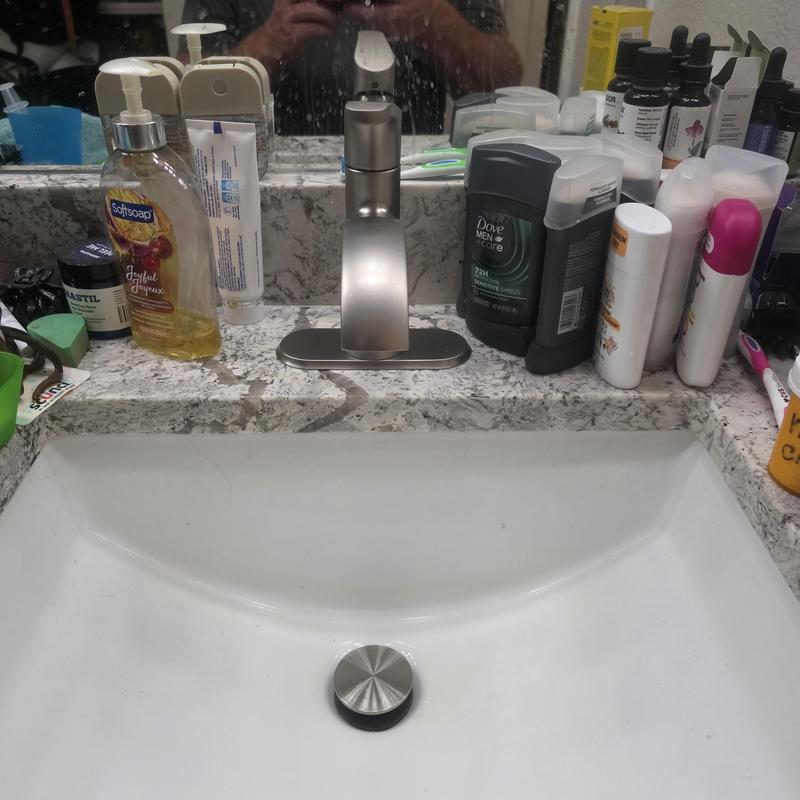 Lavatory faucet and sink with countertop items