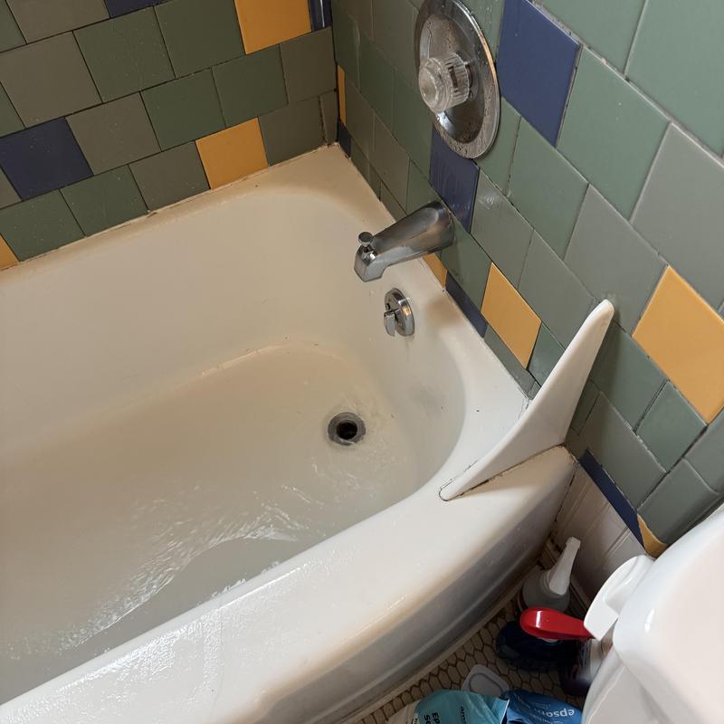 Shower drain flow test and faucet spout in tub