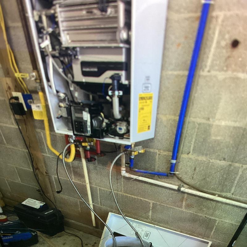 Tankless water heater with replaced gas valve and PCB