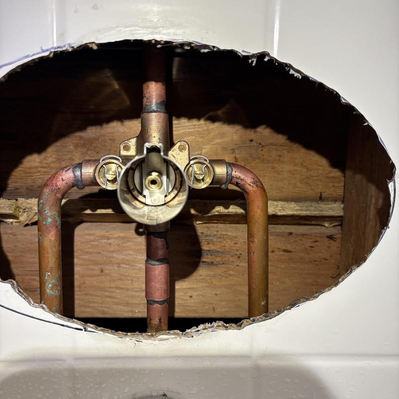 Shower valve plumbing inside wall cavity repair