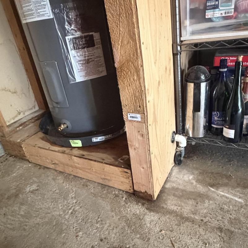 50-gallon electric water heater with wooden frame base