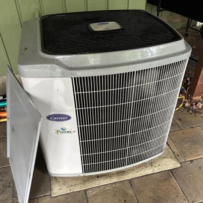 Carrier outdoor AC unit with open disconnect box panel Carrier outdoor AC unit with open disconnect box panel