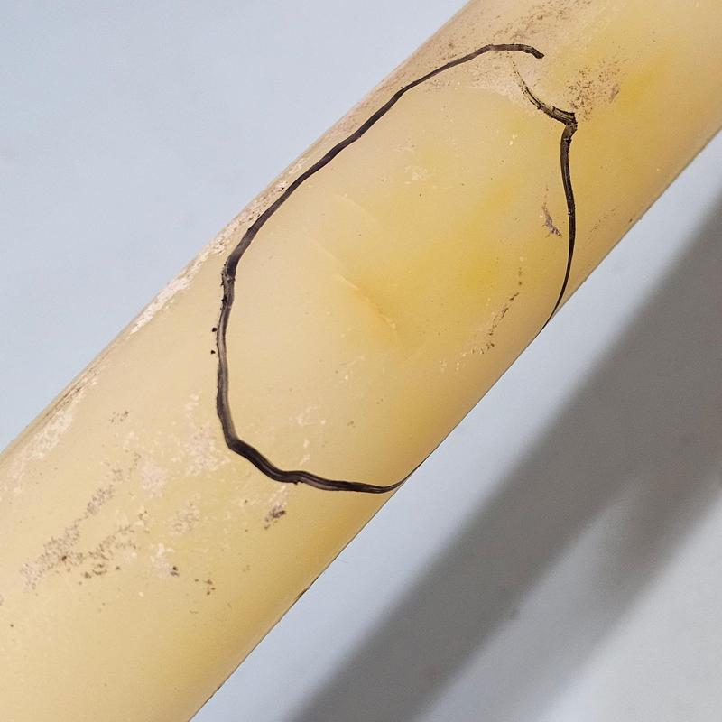 1 inch PEX pipe with crack marked for repair