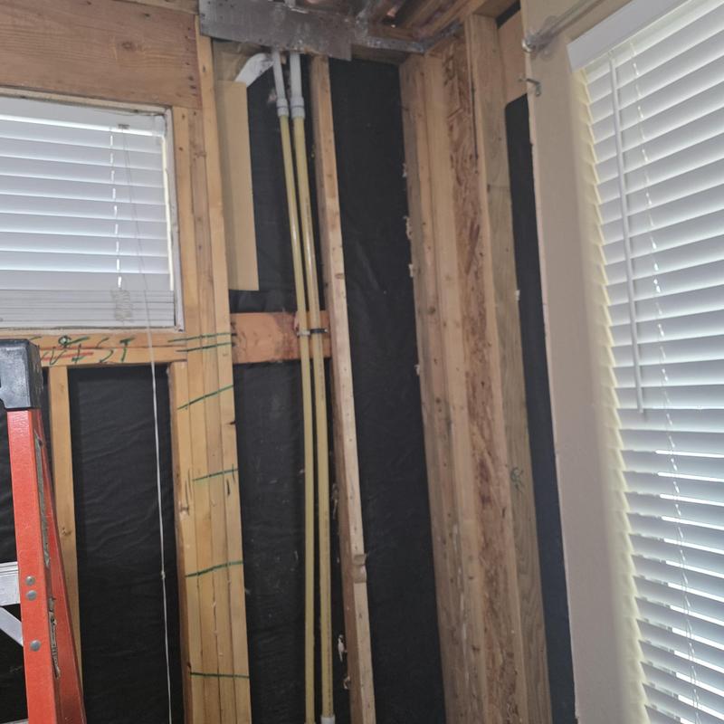 1-inch PEX piping in ceiling cavity with wood framing