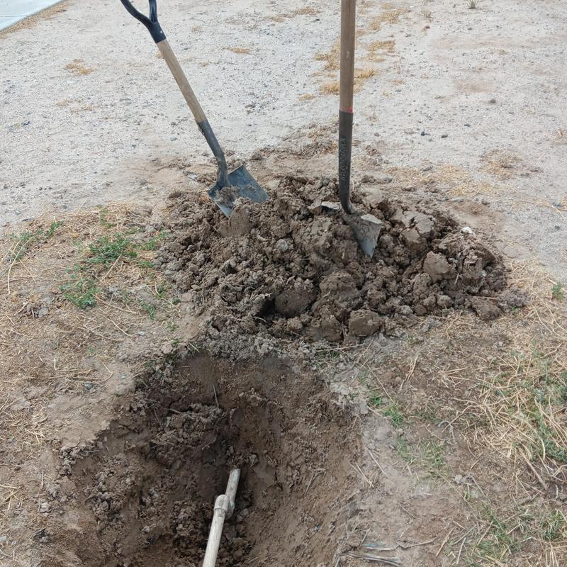 Copper type L 1-inch water service installation site with shovels Copper type L 1-inch water service installation site with shovels