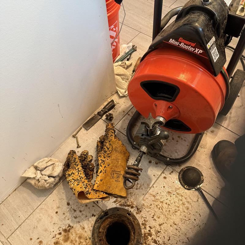 Main sewer line cleaning machine and gloves