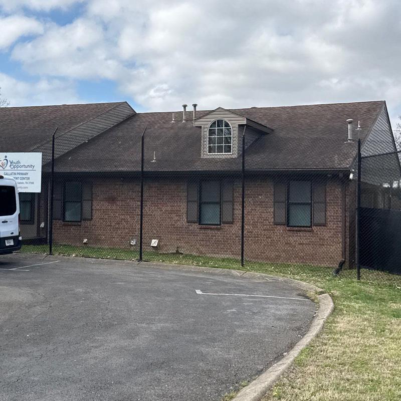 Asphalt shingle roof with hail damage inspection on commercial building