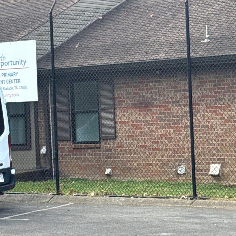 Asphalt shingle roof with hail damage on commercial building