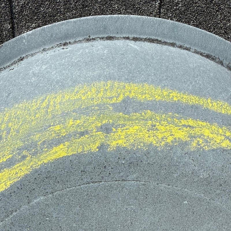 Metal roof vent with yellow chalk marking