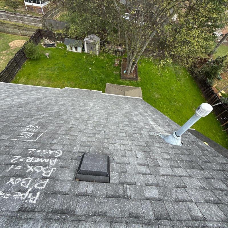 Asphalt shingle roof with hail damage markings
