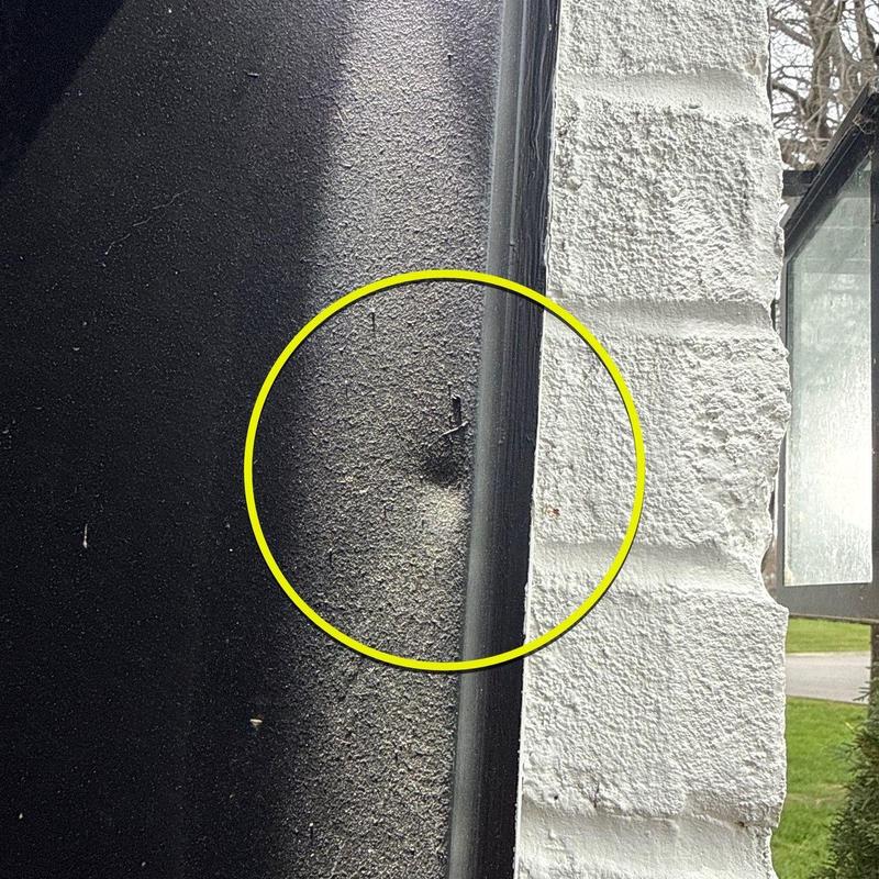 Roof shingles with hail damage near flashing