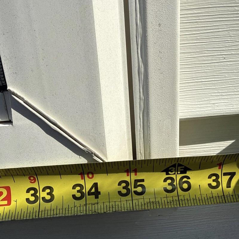 Window frame measurement with visible sealant and tape