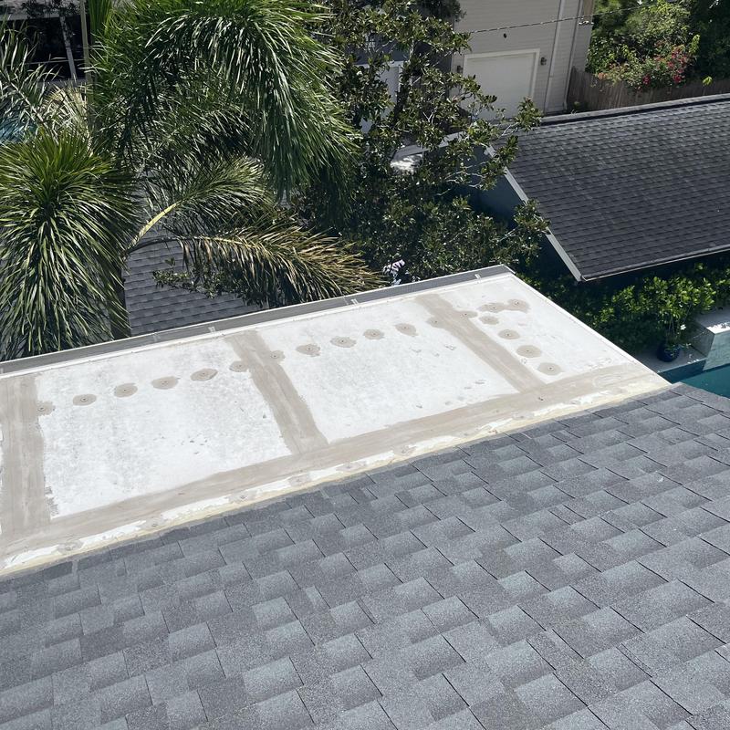 Flat roof patch and shingle roof intersection detail Flat roof patch and shingle roof intersection detail