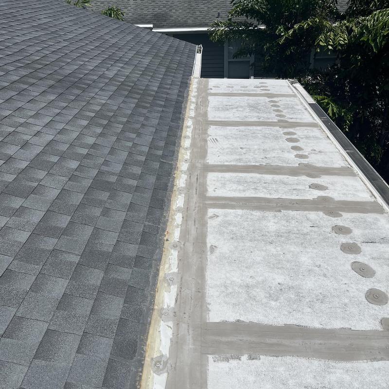 TPO flat roof and shingle roof junction in Hudson FL TPO flat roof and shingle roof junction in Hudson FL