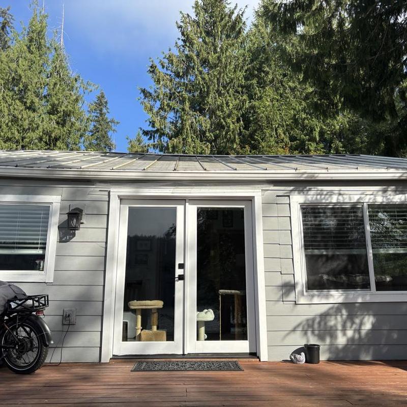 Metal roof panels on backyard house exterior