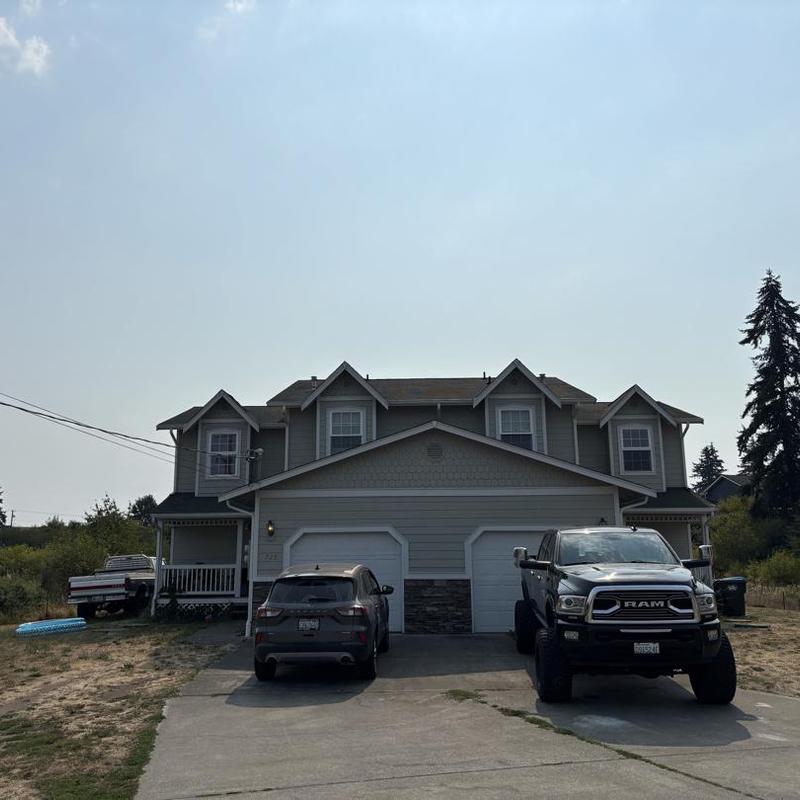 Asphalt shingle roof on two-story house