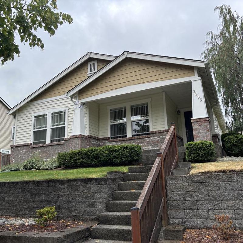 House roof with brick and siding exterior in Hayden, ID