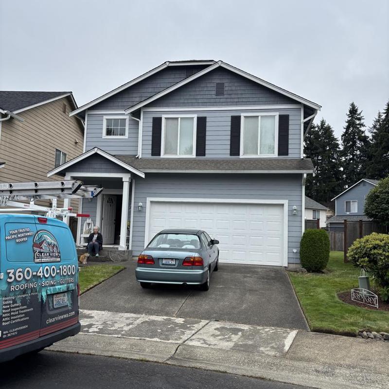 Asphalt shingle roof on two-story suburban home
