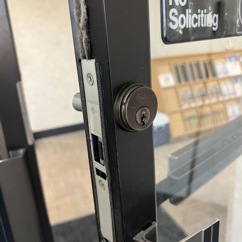 Door cylinder lock rekey on commercial glass door Door cylinder lock rekey on commercial glass door